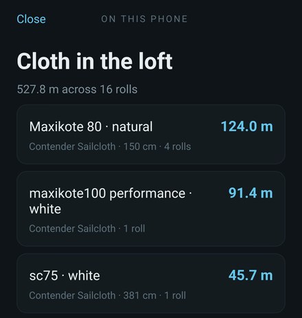 The stock screen in the app: Cloth in the loft, 527.8 m across 16 rolls, totalled per cloth